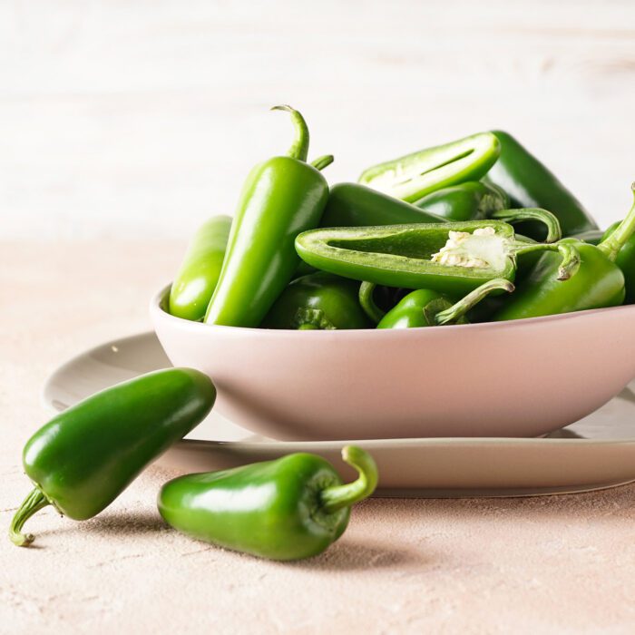 Green jalapeno peppers in bowl. Olive Lucy Jalapeno Fused Olive Oil